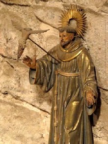Imatge de Sant Francesc d'Ass&iacute;s rebent els estigmes. Fusta tallada i policromada. Prov&eacute; de l'antiga capella de Ca l'Isalguer. Segle XVIII